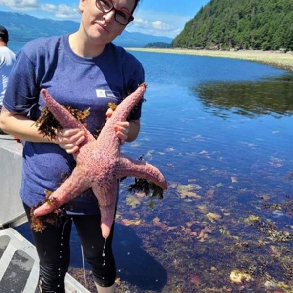 VIU student holding a pink starfish