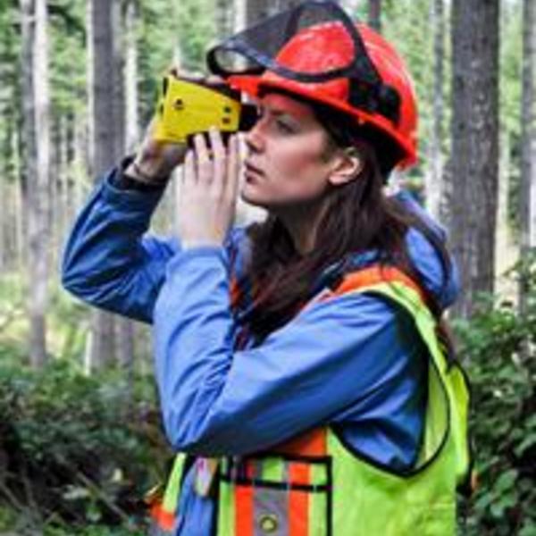 Woman using laser range finder